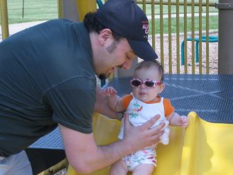 On the slide with Daddy