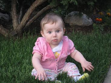 Zoe sitting on grass